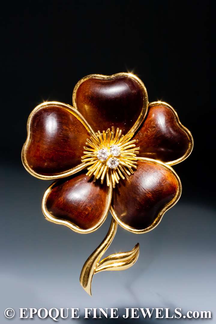 An 18 karat gold and wood 'clematite' flower brooch